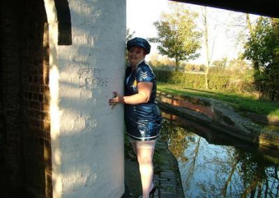 Older redhead Valgasmic Exposed exposes herself by a canal in a police uniform 17304630