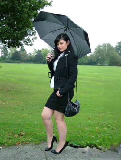 Fully clothed model Nicola takes a walk on park pathway in her new black pumps 85035903