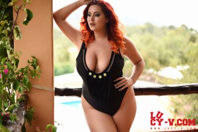 Natural redhead Lucy Vixen rocks hr big butt before revealing her big boobs